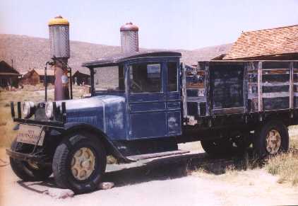 note the two old gas pumps behind the truck