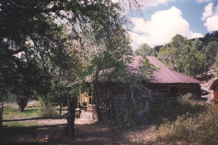 this building is surrounded by trees...and a stream