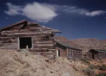 the front buiulding is made of railroad ties