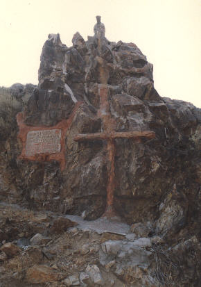 notice the statue on top of the rock formation