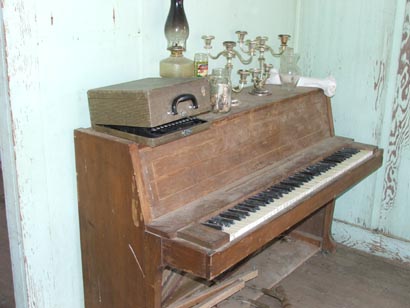 this piano was still there in 2011, although the items on top were missing